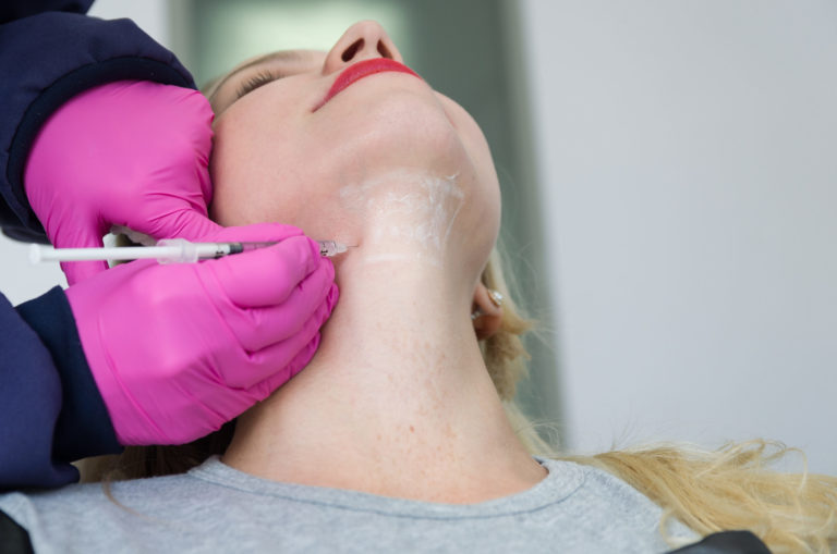 Woman getting double chin injection